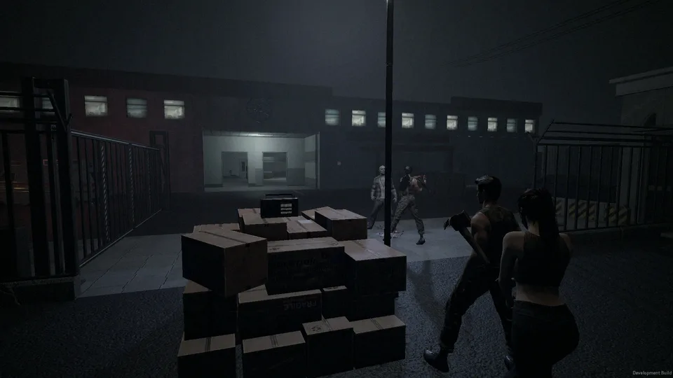Four survivors work a crate of supplies on a fogged Ashbrook street