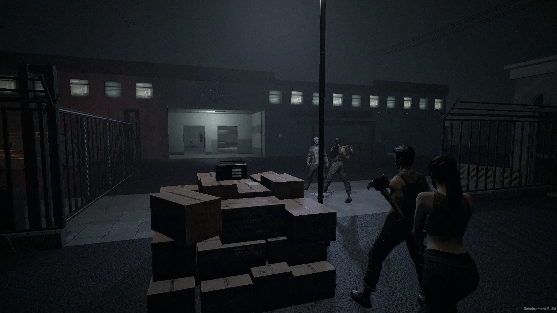 Four survivors work a crate of supplies on a fogged Ashbrook street